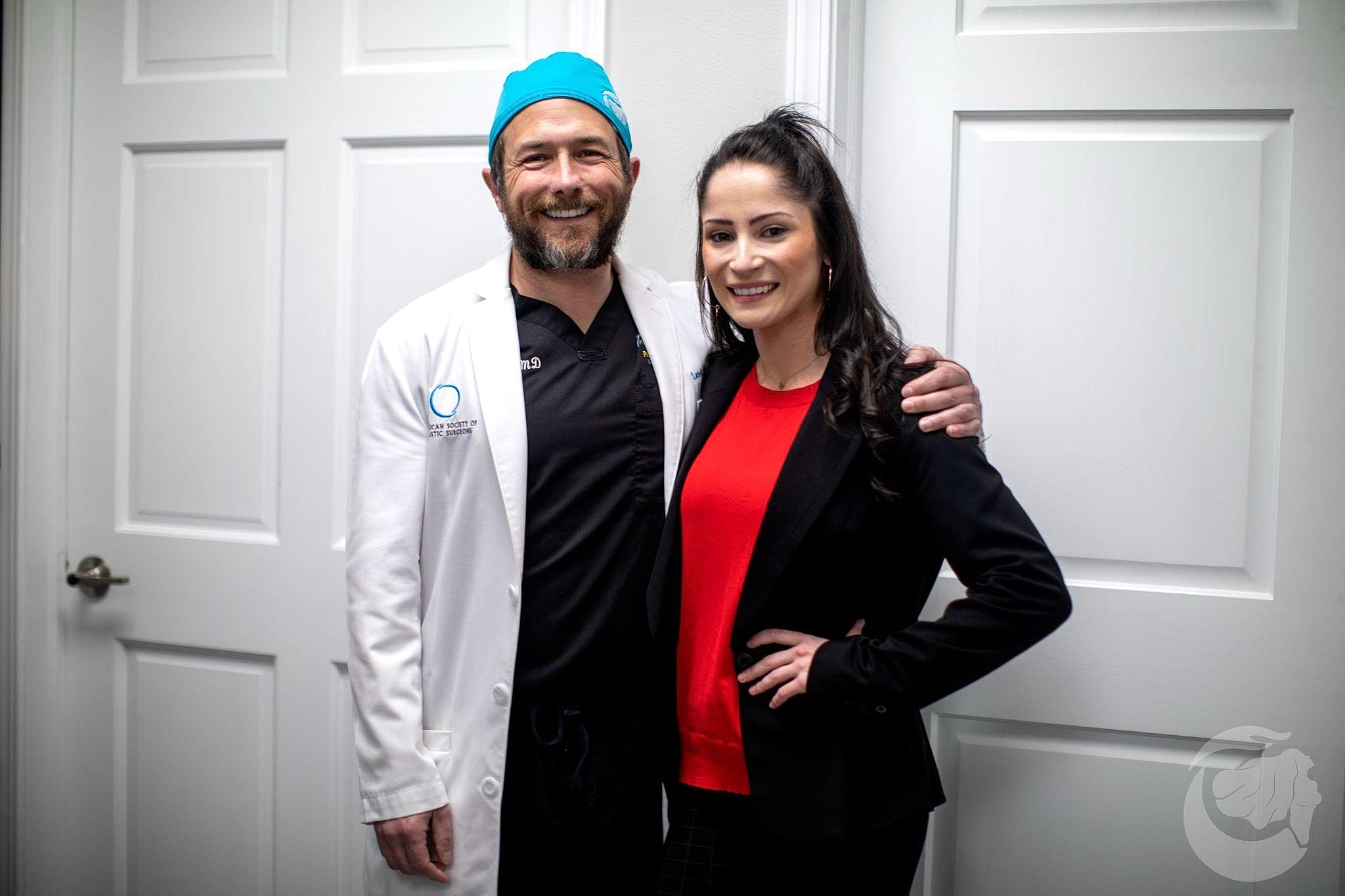 Doctor and colleague posing for a photo.